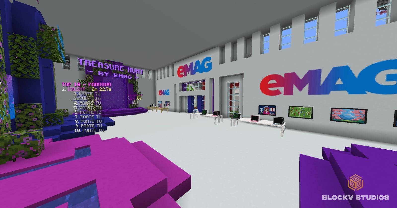 The eMAG hub lobby with branded walls and computer desks
